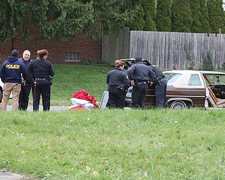  ROBERT K.YOSAY  | THE VINDICATOR...after a triple homicide at Gibson St and Pasadena Ave on the city's southside Wed Night officers detained a car and arrested the driver on charges of drug paraphernalia and a gun..