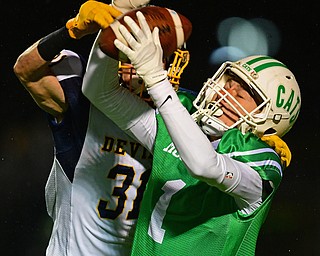 AURORA, OHIO - NOVEMBER 9, 2018: Mogadore's Nathan Stephenson has a pass knocked from his hands by McDonald's Alex Cintron during the second half of their game, Friday night at Aurora High School. Mogadore won 28-7. DAVID DERMER | THE VINDICATOR