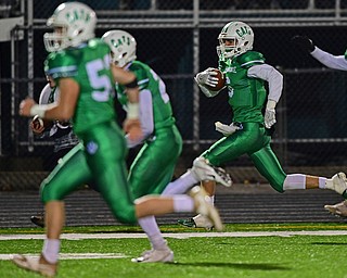 AURORA, OHIO - NOVEMBER 9, 2018: Mogadore's Eli Robertson runs down the sideline to score a touchdown after intercepting a McDonald pass during the second half of their game, Friday night at Aurora High School. Mogadore won 28-7. DAVID DERMER | THE VINDICATOR