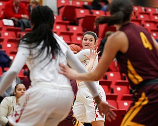 YSU's Alison Smolinski looks to pass the ball during the first half of their game against Loyola at YSU on Friday night. EMILY MATTHEWS | THE VINDICATOR