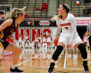 YSU's Alison Smolinski looks to pass while Loyola's Ellie Rice watches the ball during the first half of their game at YSU on Friday night. EMILY MATTHEWS | THE VINDICATOR