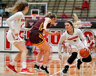 YSU's Alison Smolinski dribbles the ball while Loyola's Ellie Rice tries to block and YSU's Chelsea Olson comes up behind Rice during the first half of their game at YSU on Friday night. EMILY MATTHEWS | THE VINDICATOR