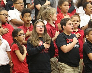  ROBERT K.YOSAY  | THE VINDICATOR..Veterans Day - Sunday - and area schools had various programs honoring veterans for their service today Friday..4th graders at Campbell Elementary put-on a program for area vets..Students place hands over their hearts and say the pledge..