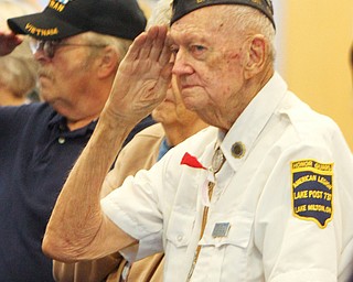 William D. Lewis The Vindicator  Murle McLaughlin, a member of American Legion post 737 salutes during a Veterans Day event at Jackson Milton HS 11-9-18.