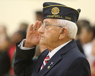  ROBERT K.YOSAY  | THE VINDICATOR..Veterans Day - Sunday - and area schools had various programs honoring veterans for their service today Friday..4th graders at Campbell Elementary put-on a program for area vets..John Texter of Am Legion post 560 Campbell..presents the colors..