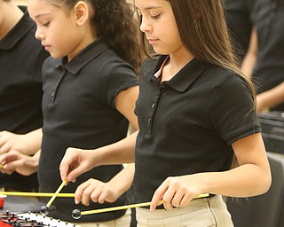  ROBERT K.YOSAY  | THE VINDICATOR..Veterans Day - Sunday - and area schools had various programs honoring veterans for their service today Friday..playing the glockenspiel is  Julitza Aponte-Gonzalez . and Yaleiska Diaz....