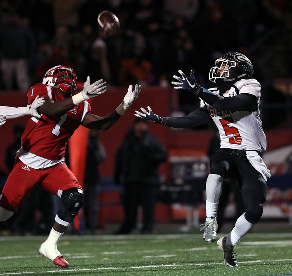 NILES, OHIO - November 10, 2018: GIRARD INDIANS vs PERRY PIRATES at Bo Rein Stadium-  1st qtr., Girard Indians' Nick Malito (5) catches a 44 yards td as Perry Pirates' Jaylen Anderson (1) defends.  MICHAEL G. TAYLOR | THE VINDICATOR