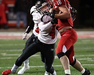NILES, OHIO - November 10, 2018: GIRARD INDIANS vs PERRY PIRATES at Bo Rein Stadium-  2nd qtr., Girard Indians' Aiden Warga (4) tackles Perry Pirates' Jacob Allen (16) for short gain.  MICHAEL G. TAYLOR | THE VINDICATOR