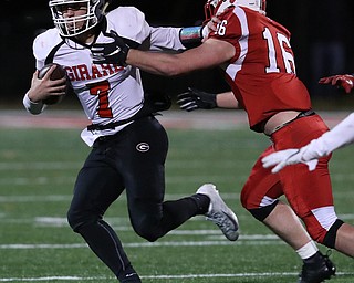 NILES, OHIO - November 10, 2018: GIRARD INDIANS vs PERRY PIRATES at Bo Rein Stadium-  2nd qtr., Girard Indians' Mark Waid (7) stiff arms Perry Pirates' Jacob Allen (16) to pickup the 1st down.  MICHAEL G. TAYLOR | THE VINDICATOR