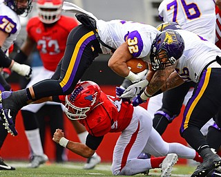 YOUNGSTOWN, OHIO - NOVEMBER 11, 2018: Youngstown State's Armand Dellovade takes out North Iowa's Tyler Hoosman during the first half of their game, Saturday afternoon at Stambaugh Stadium. DAVID DERMER | THE VINDICATOR