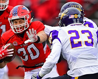 YOUNGSTOWN, OHIO - NOVEMBER 11, 2018: Youngstown State's Joe Alessi runs away from Northern Iowa's A.J. Allen and Christian Jegen during the first half of their game, Saturday afternoon at Stambaugh Stadium. DAVID DERMER | THE VINDICATOR