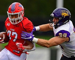 YOUNGSTOWN, OHIO - NOVEMBER 11, 2018: Youngstown State's Tevin McCaster is tackled by Northern Iowa's Duncan Ferch during the second half of their game, Saturday afternoon at Stambaugh Stadium. DAVID DERMER | THE VINDICATOR