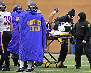 YOUNGSTOWN, OHIO - NOVEMBER 11, 2018: Northern Iowa's Briley Moore raises his fist as he is carted off the field after sustaining an injury during the second half of their game, Saturday afternoon at Stambaugh Stadium. DAVID DERMER | THE VINDICATOR