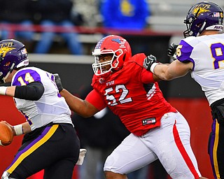 YOUNGSTOWN, OHIO - NOVEMBER 11, 2018: Northern Iowa's Eli Dunne is sacked by Youngstown State's Savon Smith during the second half of their game, Saturday afternoon at Stambaugh Stadium. DAVID DERMER | THE VINDICATOR