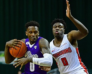 CLEVELAND, OHIO - NOVEMBER 11, 2018: Akron's Jimond Ivey drives on Youngstown State's Antwan Maxwell Jr. during the second half of their game, Saturday afternoon at Cleveland State University. DAVID DERMER | THE VINDICATOR