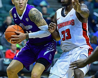 CLEVELAND, OHIO - NOVEMBER 11, 2018: Akron's Channel Banks drives on Youngstown State's Naz Bohannon during the second half of their game, Saturday afternoon at Cleveland State University. DAVID DERMER | THE VINDICATOR