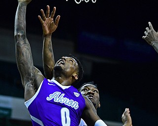 CLEVELAND, OHIO - NOVEMBER 11, 2018: Akron's Jimond Ivey goes to the basket against Youngstown State's Kendale Hampton during the second half of their game, Saturday afternoon at Cleveland State University. DAVID DERMER | THE VINDICATOR