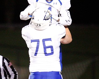 Hubbard's JayQuan Odem and Anthony Shaffer (76) celebrate after Odem scores a touchdown during the first half of their game against Steubenville on Saturday night at Boardman. EMILY MATTHEWS | THE VINDICATOR
