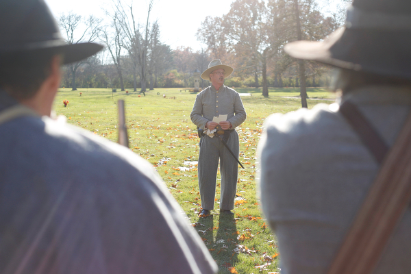 Ron Novak, of Columbiana, speaks about local veterans at their grave sites during the Forgotten Heroes program in Forest Lawn Cemetery in Boardman on Sunday. EMILY MATTHEWS | THE VINDICATOR