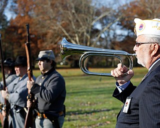 John P. "JP" Brown III, of Boardman, plays taps during the Forgotten Heroes program in Forest Lawn Cemetery in Boardman on Sunday. EMILY MATTHEWS | THE VINDICATOR