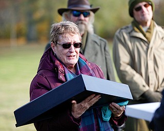 Suzanne Zadell, of Vermilion, is presented with an American flag in honor of all she has done to learn more about her father, Raymond Eckert, who had been a sergeant with the 82nd Airborne Medical Division and died after his glider crashed on D-Day, during the Forgotten Heroes program in Forest Lawn Cemetery in Boardman on Sunday. EMILY MATTHEWS | THE VINDICATOR