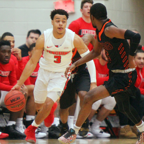 William D. Lewis The Vindicator  YSU's Darius Quisenberry(3) drives around Heildelberg's Phariz Watkins(5) during 11-12-18 action at YSU.