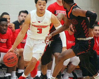 William D. Lewis The Vindicator  YSU's Darius Quisenberry(3) drives around Heildelberg's Phariz Watkins(5) during 11-12-18 action at YSU.