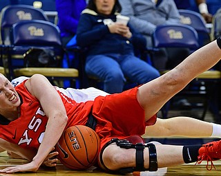 PITTSBURGH, PENNSYLVANIA - NOVEMBER 13, 2018: Youngstown State's Sarah keeps the ball away from Pittsburgh's Alayna Gribble during the second half of their game, Tuesday night at the Petersen Events Center. Youngstown State won 64-55. DAVID DERMER | THE VINDICATOR