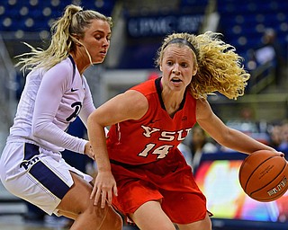 PITTSBURGH, PENNSYLVANIA - NOVEMBER 13, 2018: Youngstown State's McKenah Peters drives on Pittsburgh's Cassidy Walsh during the second half of their game, Tuesday night at the Petersen Events Center. Youngstown State won 64-55. DAVID DERMER | THE VINDICATOR