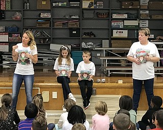 Neighbors | Jessica Harker.Laura and Diane Demetrios along with two of Lauras children read to students at Boardman Market Street elementary school for the annual "Listen to Leslie" anti bullying event.