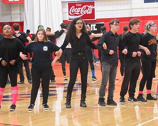 Neighbors | Jessica Harker.Students dressed all in black for "black out" day sung Austintown's alma mater during the school's assembly.