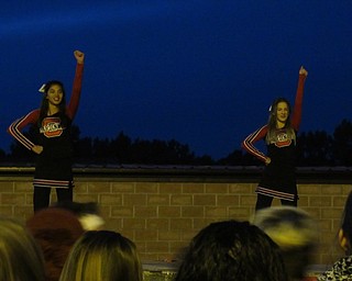 Neighbors | Jessica Harker.Canfield cheerleaders performed for the community at the school's bonfire event in preperation for the game against Poland high school Oct. 26.