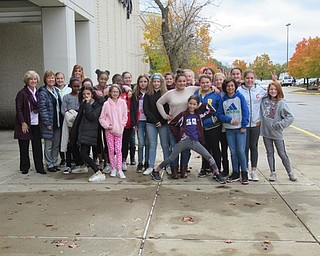 Neighbors | Jessica Harker.From left, United Way representative Kathy Mock and Boardman counselor Linda Frease posed with sixth-grade girls who are part of the Girls Empowerment Mentorship Program on Nov. 5 outside of Macy's in Boardman.