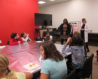 Neighbors | Jessica Harker.Sixth-grade girls got snacks and drinks as they listened to professionals from Macy's about healthy skin care routines and confidence building on Nov. 5.