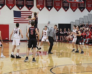Neighbors | Abby Slanker.Canfield High School boys varsity Head Coach Todd Muckleroy tossed up the tip off to start a scrimmage of the varsity team during the Meet the Team Rally at Canfield High School on Nov. 8.