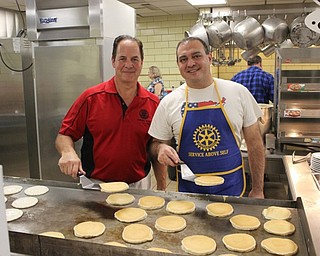 Neighbors | Abby Slanker.Canfield Rotary Club members Tony Bettile (left) and Emilio Sebastiani flipped pancakes during the club’s annual Pancake Breakfast on Nov. 4.