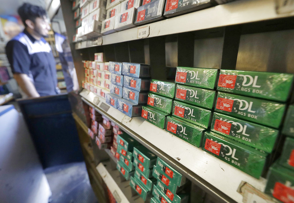 This file photo shows packs of menthol cigarettes and other tobacco products at a store in San Francisco. On Thursday, Nov. 15, 2018, FDA Commissioner Dr. Scott Gottlieb pledged to ban menthol from cigarettes, in what could be a major step to further push down U.S. smoking rates.