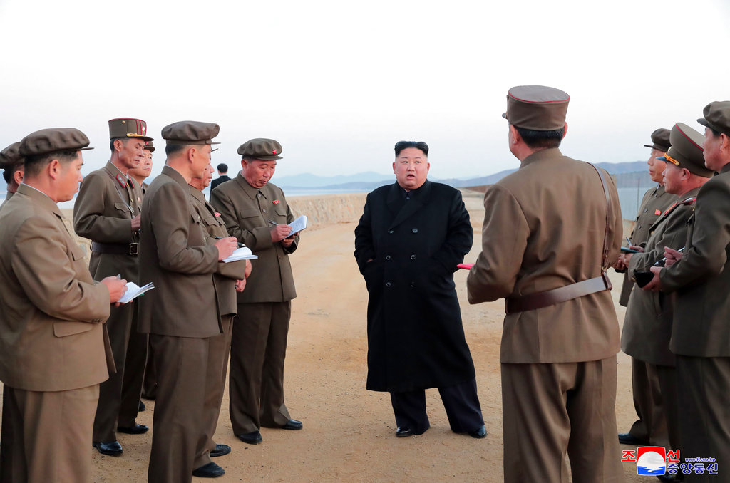 n this undated photo released Friday, Nov. 16, 2018, by the North Korean government, North Korean leader Kim Jong Un, center, listens to a military official as he inspects a weapon testing at the Academy of National Defense Science, North Korea. Kim observed the successful test of a "newly developed high-tech tactical" weapon, the nation's state media reported Friday, though it didn't describe what sort of weapon it was. Independent journalists were not given access to cover the event depicted in this image distributed by the North Korean government. The content of this image is as provided and cannot be independently verified. Korean language watermark on image as provided by source reads: "KCNA" which is the abbreviation for Korean Central News Agency.