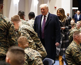 President Donald Trump and first lady Melania Trump visit with Marines at the Marine Barracks Washington, Thursday, Nov. 15, 2018, in Washington.