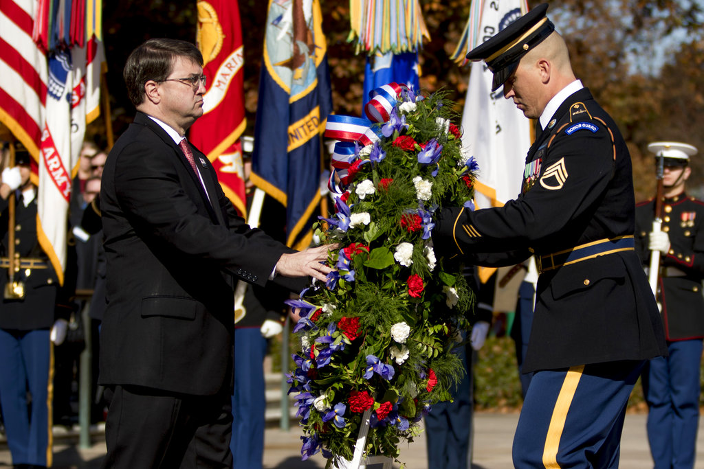 Veterans Affairs Secretary Robert Wilkie places a wreath at the Tomb of the Unknown Soldier during a ceremony at Arlington National Cemetery on Veterans Day, Sunday, Nov. 11, 2018, in Arlington, Va.