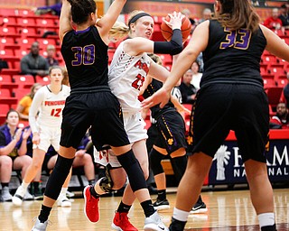 YSU's Sarah Cash tries to get the ball past Carlow's Emma Stille (30) and Bria Rathway (33) during their game Friday night at YSU. EMILY MATTHEWS | THE VINDICATOR