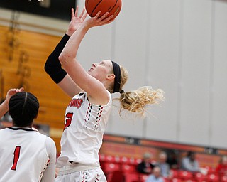 YSU's Sarah Cash goes for a basket during their game against Carlow Friday night at YSU. EMILY MATTHEWS | THE VINDICATOR