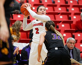 YSU's Alison Smolinski tries to keep the ball away from Carlow's Kayla Brownlee as she looks to pass during their game Friday night at YSU. EMILY MATTHEWS | THE VINDICATOR