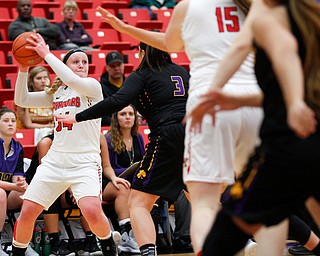 YSU's McKenah Peters looks to pass the ball  during their game against Carlow Friday night at YSU. EMILY MATTHEWS | THE VINDICATOR