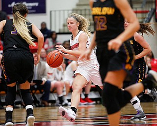 YSU's Melinda Trimmer dribbles the ball down the court during their game against Carlow on Friday night at YSU. EMILY MATTHEWS | THE VINDICATOR