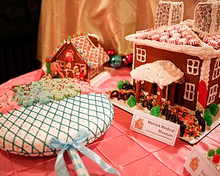 Gingerbread houses are displayed in the Memories of Christmas Past exhibition at The Arms Family Museum on Saturday. EMILY MATTHEWS | THE VINDICATOR