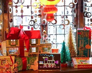 Vintage toys are displayed in a living room in the Memories of Christmas Past exhibition at The Arms Family Museum on Saturday. EMILY MATTHEWS | THE VINDICATOR