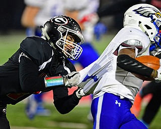 NILEs, OHIO - NOVEMBER 17, 2018: Girard's Morgan Clardy tackles Hubbard's JayQuan Odem during the second half of the OHSAA Division 4 Region 13 Regional Final game, Saturday night at Niles McKinley High School. DAVID DERMER | THE VINDICATOR