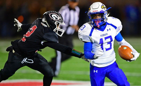 NILEs, OHIO - NOVEMBER 17, 2018: Hubbard's XXX runs away from Girard's XXX during the second half of the OHSAA Division 4 Region 13 Regional Final game, Saturday night at Niles McKinley High School. DAVID DERMER | THE VINDICATOR