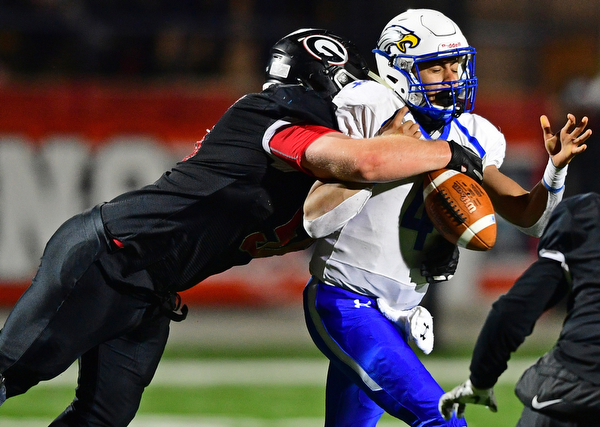 NILEs, OHIO - NOVEMBER 17, 2018: Girard's XXX hits Hubbard's XXX ,forcing a fumble that would be recovered by Girard, during the second half of the OHSAA Division 4 Region 13 Regional Final game, Saturday night at Niles McKinley High School. DAVID DERMER | THE VINDICATOR